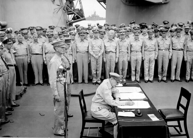 General of the Army Douglas MacArthur signs the Instrument of Surrender on behalf of the Allied Powers (US Navy)